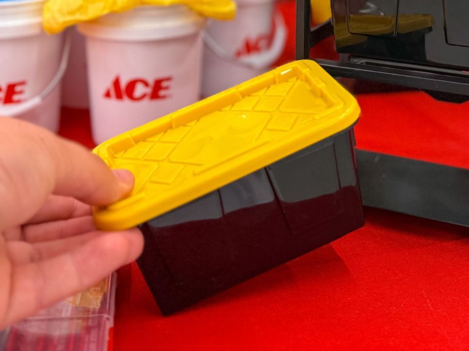 hand holding ace hardware Stackable Mini Bin Storage Tote in store