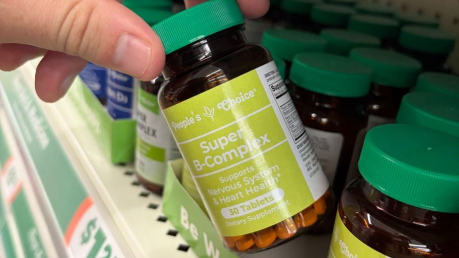 hand holding dollar tree Super b complex