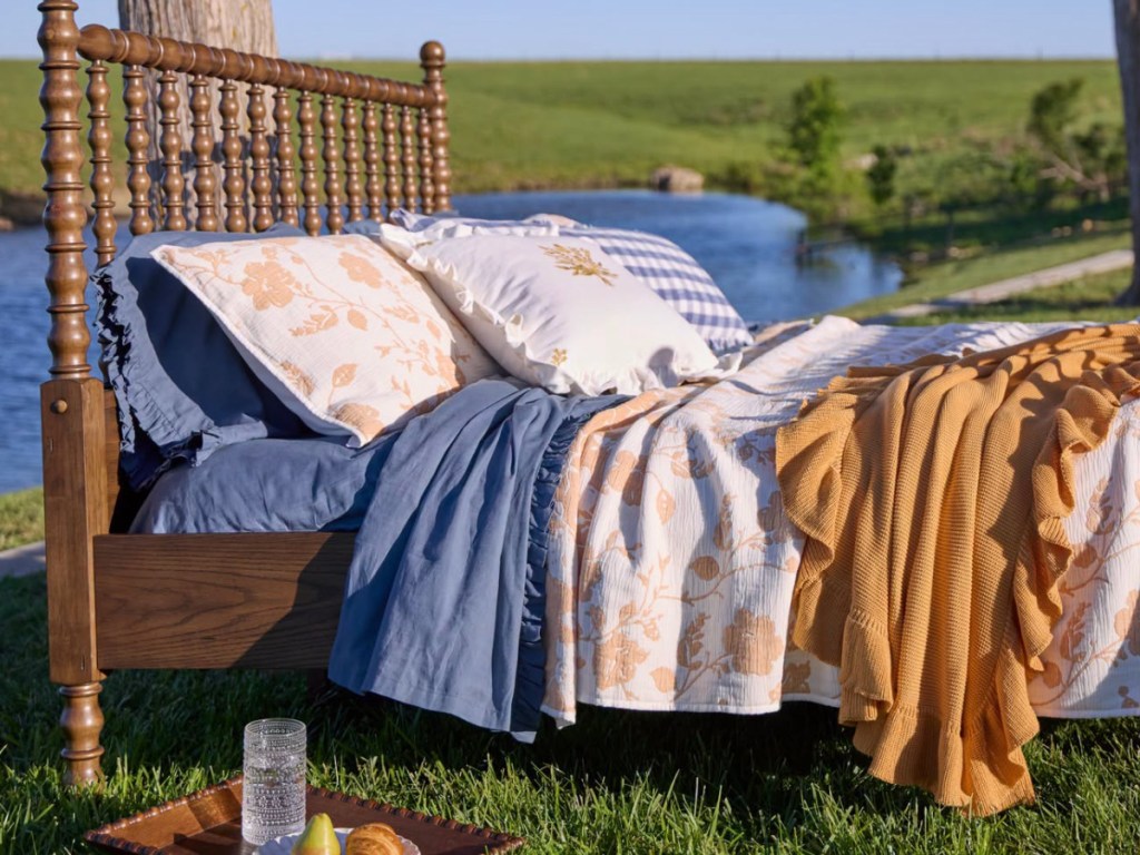 the pioneer woman bedding and blankets on bed frame outside