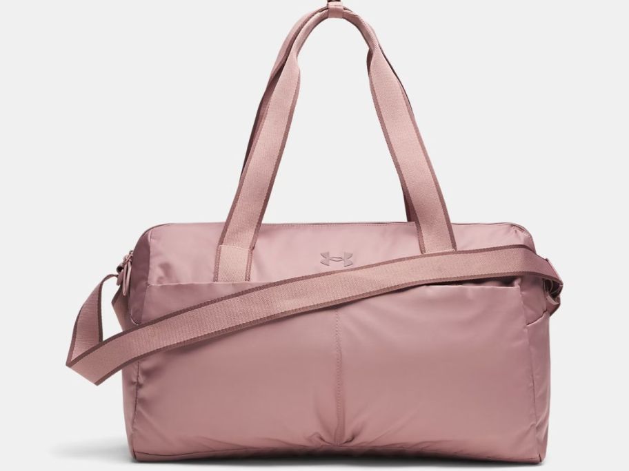 Stock image of a dusty pink colored Under Armour Studio duffle bag