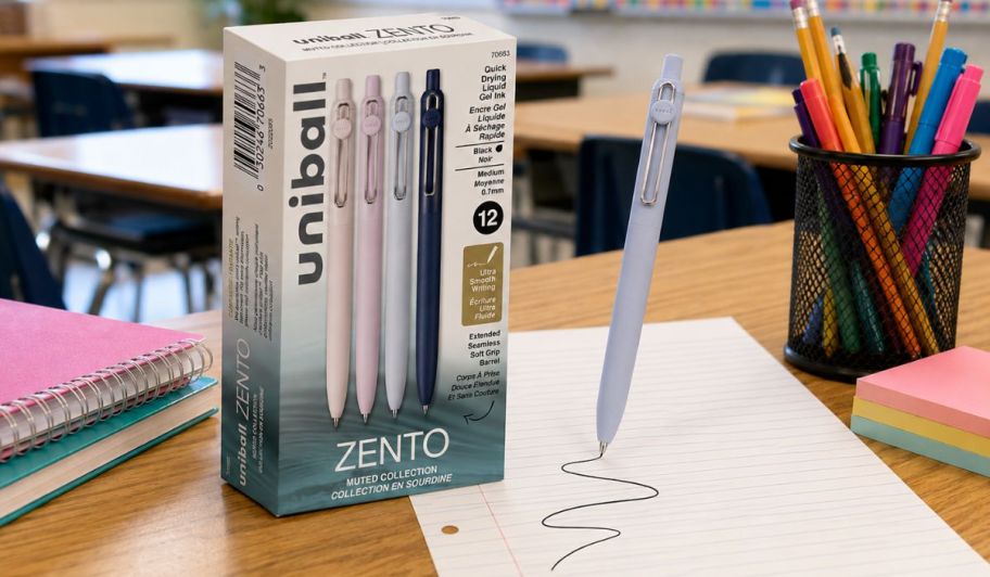 Uniball pens set on top of a classroom table 