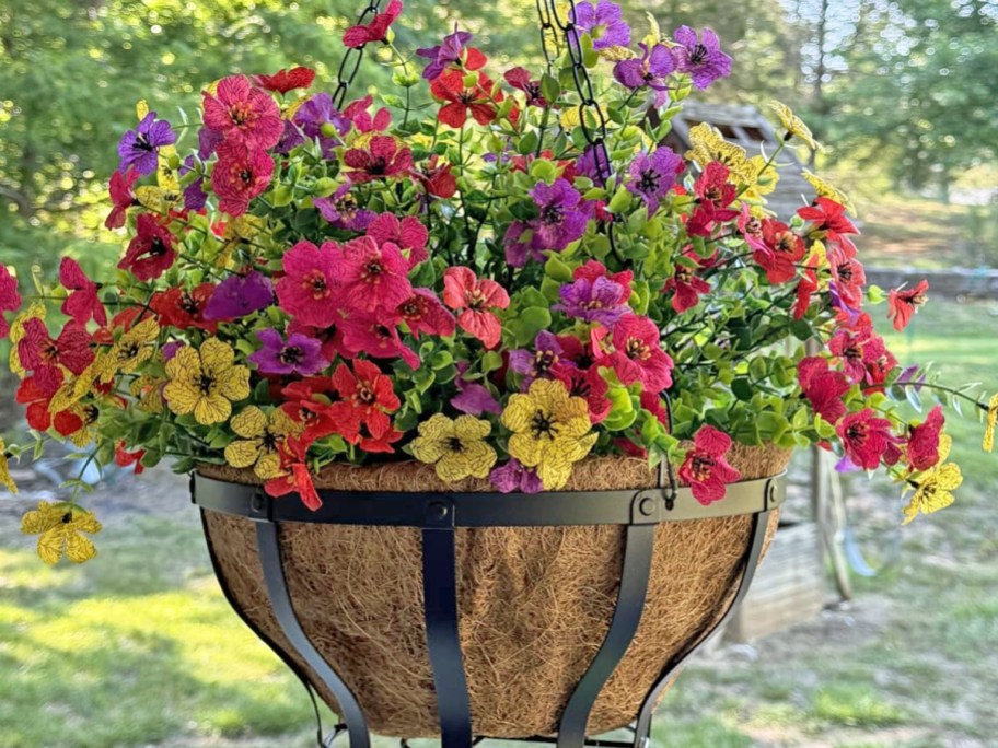 colorful artificial flowers in a hanging basket