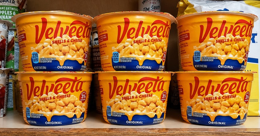 6 Velveeta Shells & Cheese Cups on a pantry shelf