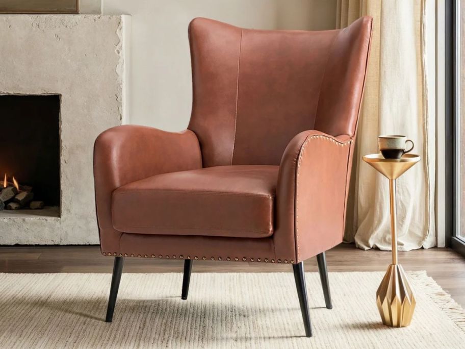 Wade Logan Ebbert Faux Leather Wingback Armchair w/ Nailhead Trim in living room