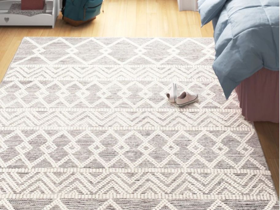 Wade Logan Kayson Moroccan Flatweave Area Rug in bedroom