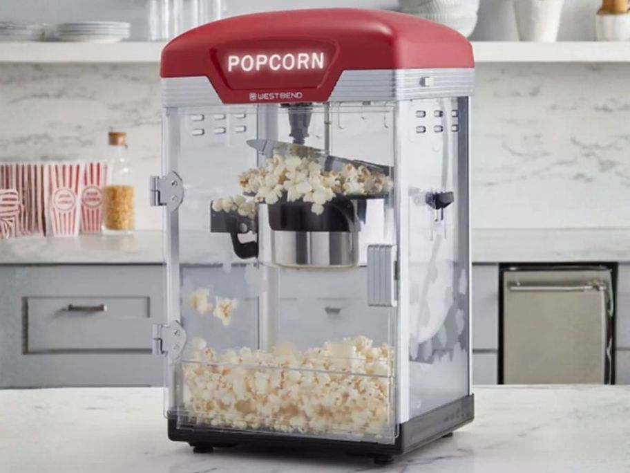 red West Bend Theater Crazy 4-Quart Popcorn Machine on kitchen counter