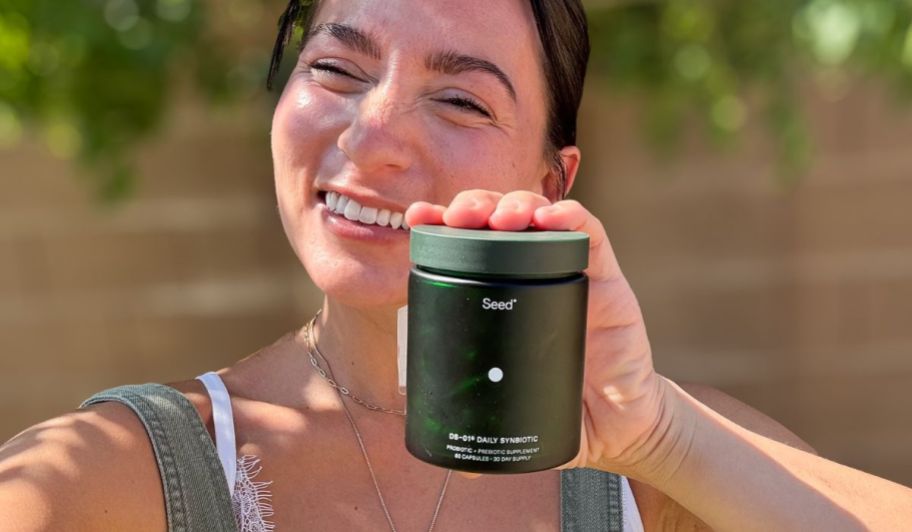 Woman holding seed probiotics