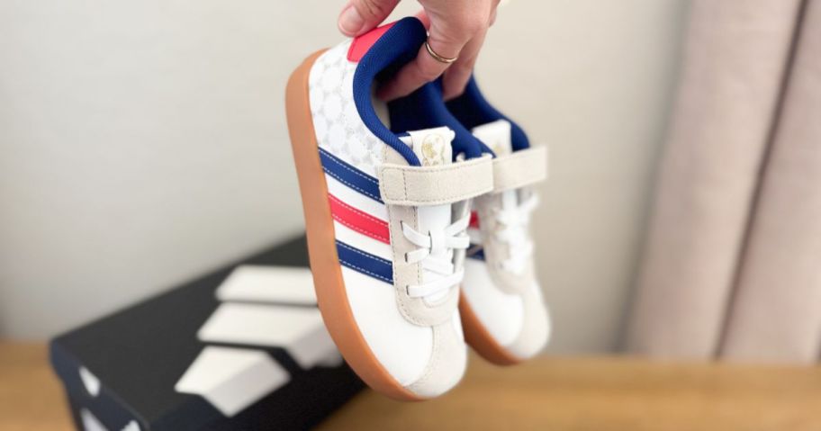hand holding adidas Kids VL Court 3.0 Shoes