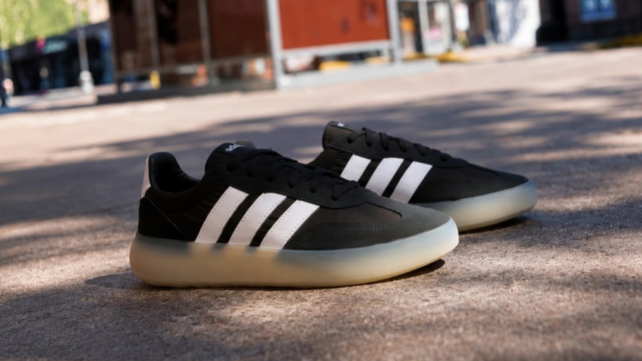 no way. A pair of black Adidas sneakers
