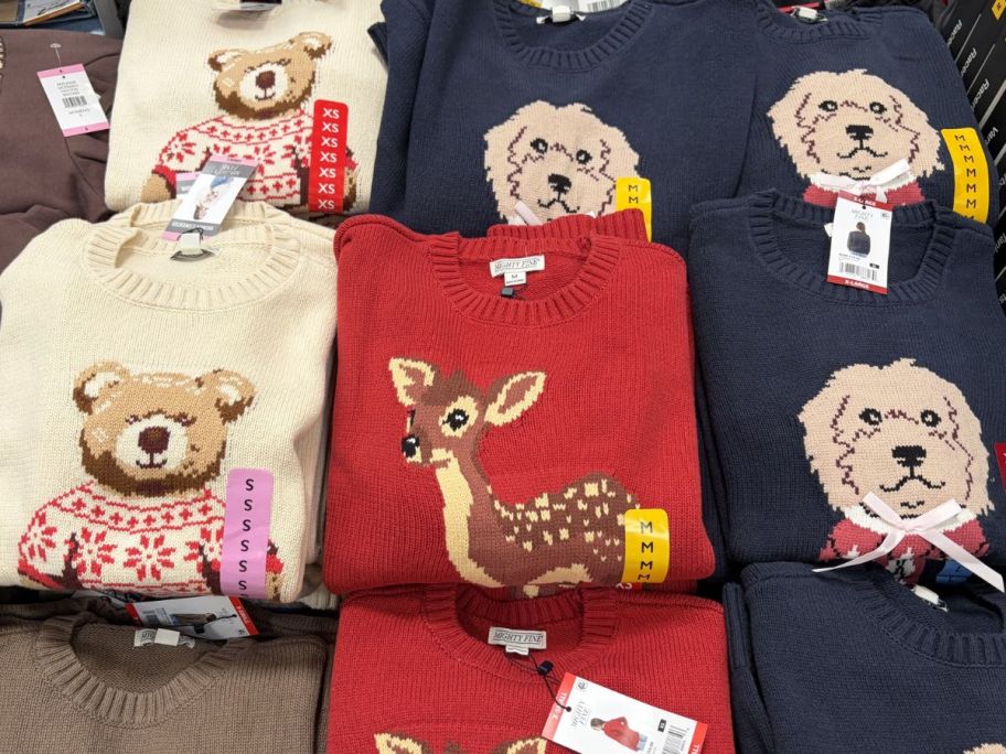 table displayed with animal sweaters from Sams club