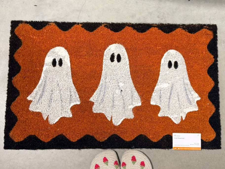 orange doormat with 3 ghosts