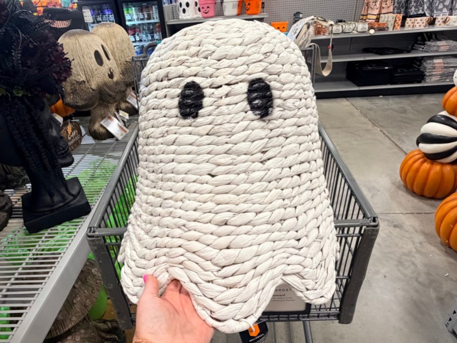 holding a white sawgrass ghost in front of a shopping cart
