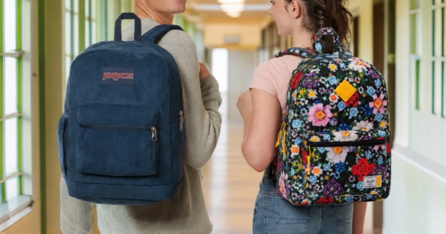 a teen boy and a teen girl with backpacks on their backs