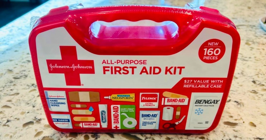 a Band-Aid First Aid Kit on a counter