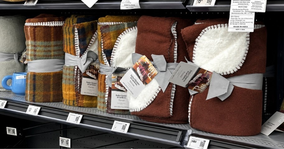 fall color plaid reversible throws on a store shelf