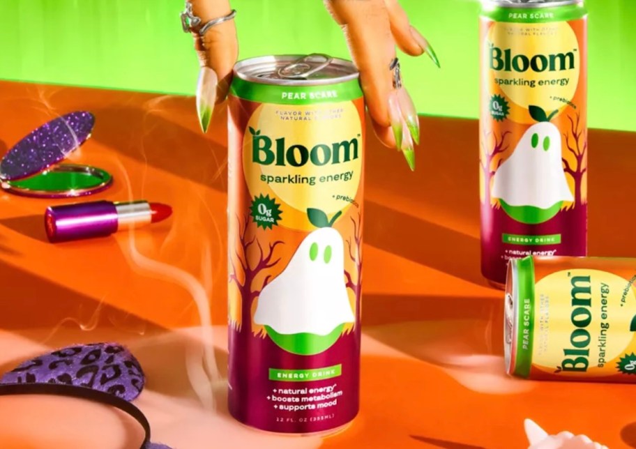 hand holding bloom energy drink 
