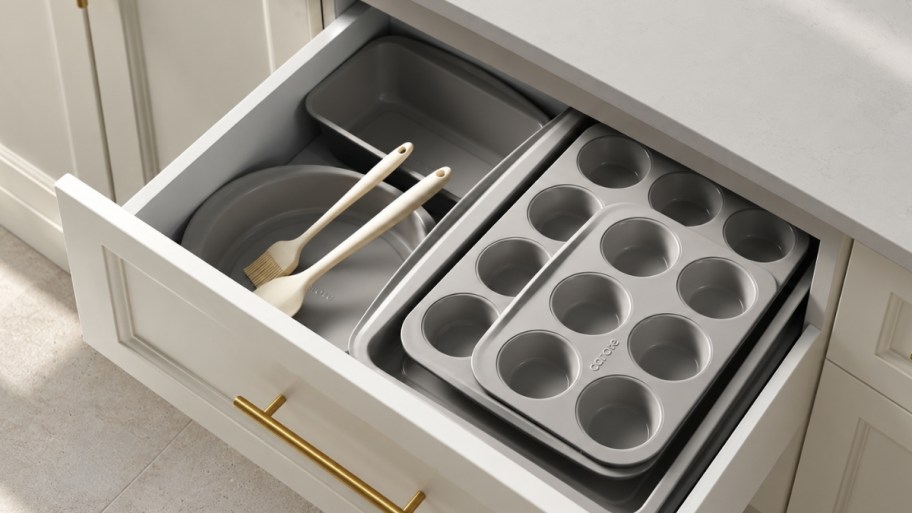 gray bakeware set in kitchen drawer 
