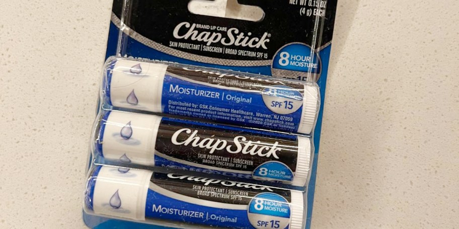 three pack of blue chapstick 