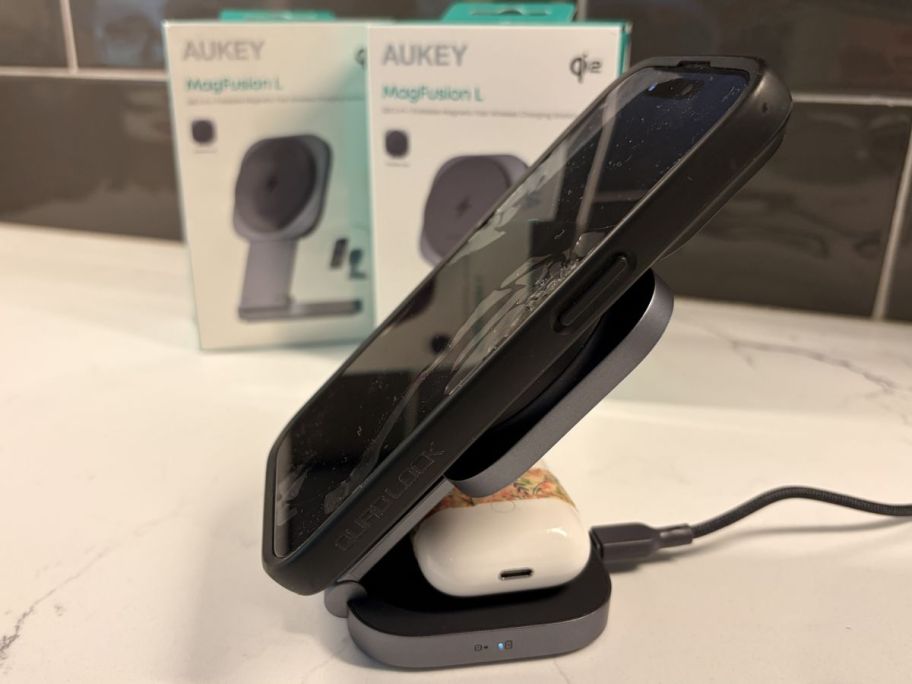 Magesafe charger with airpods and iphone displayed on it