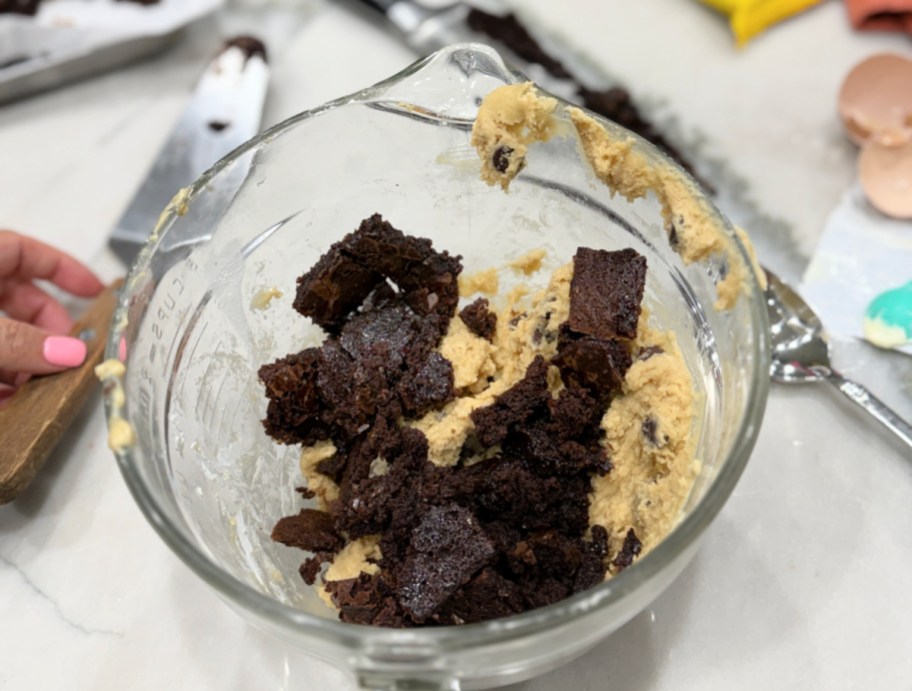 chunks of brownie inside cookie batter
