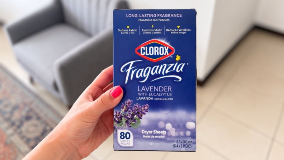 a hand holding a box of fraganzia dryer sheets