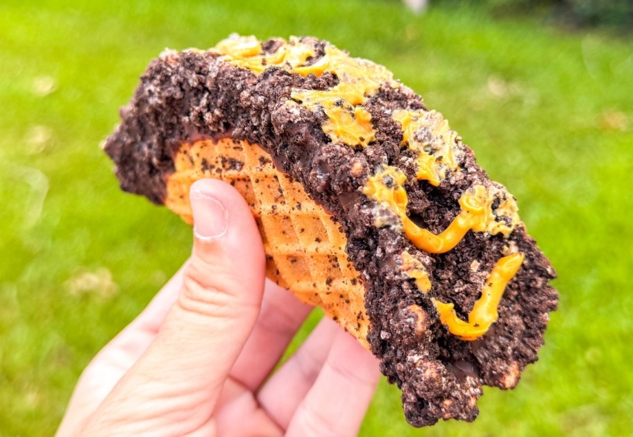 a hand holding a coldstone creamery ice cream taco