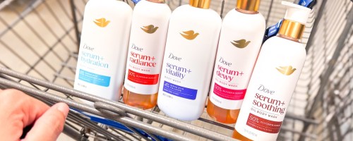 hand pushing walmart cart with dove body washes