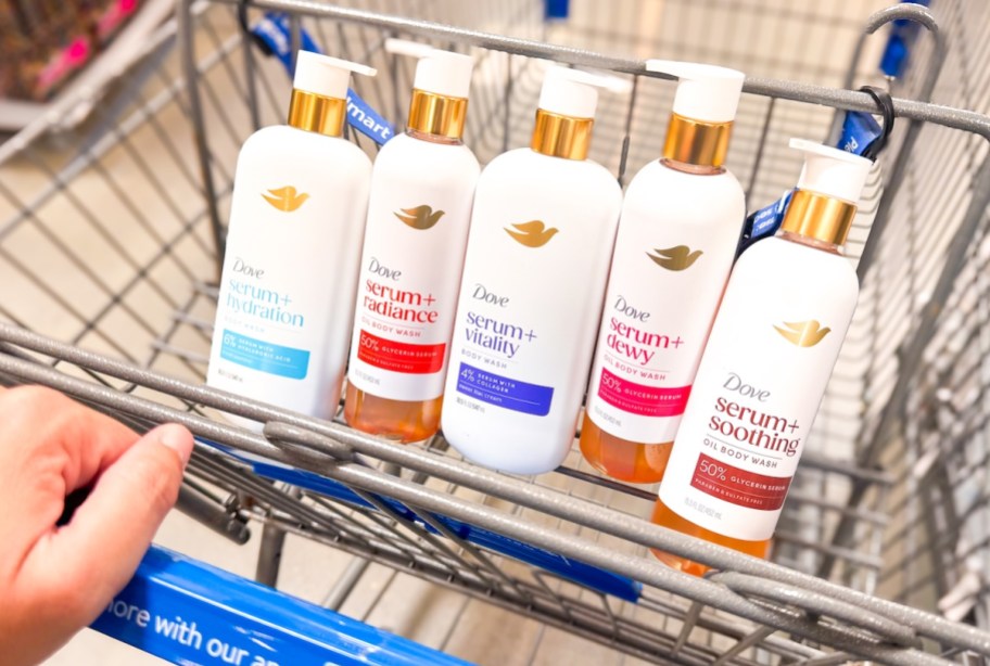 hand pushing walmart cart with dove body washes