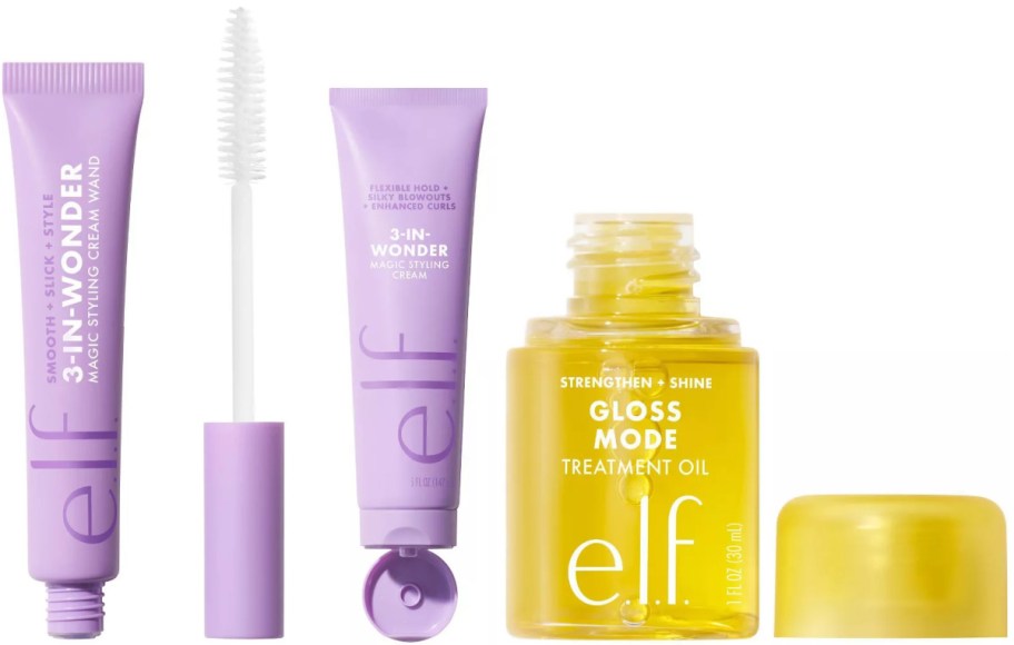 Three e.l.f. haircare products on a white background: a purple 3-in-Wonder styling cream wand with its applicator, a purple 3-in-Wonder styling cream tube, and a yellow bottle of Gloss Mode treatment oil with its cap removed.