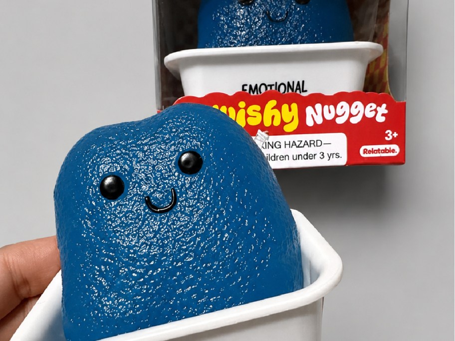 hand holding blue emotional support squishy nugget