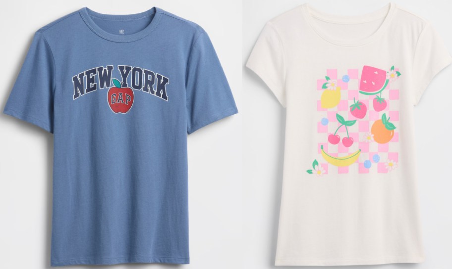 A blue short-sleeve t-shirt with a "NEW YORK GAP" apple graphic next to a white short-sleeve t-shirt with a colorful fruit and pink checkered pattern graphic.
