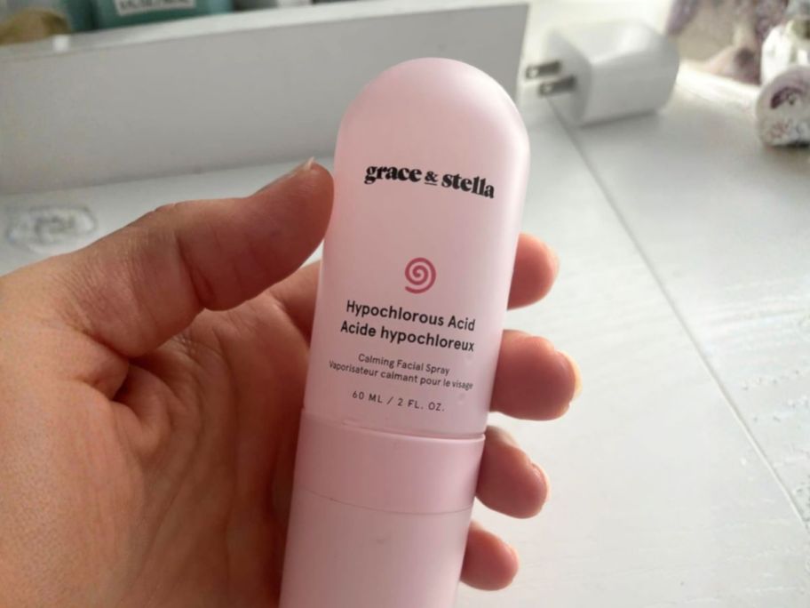 hand holding grace & stella Hypochlorous Acid Spray