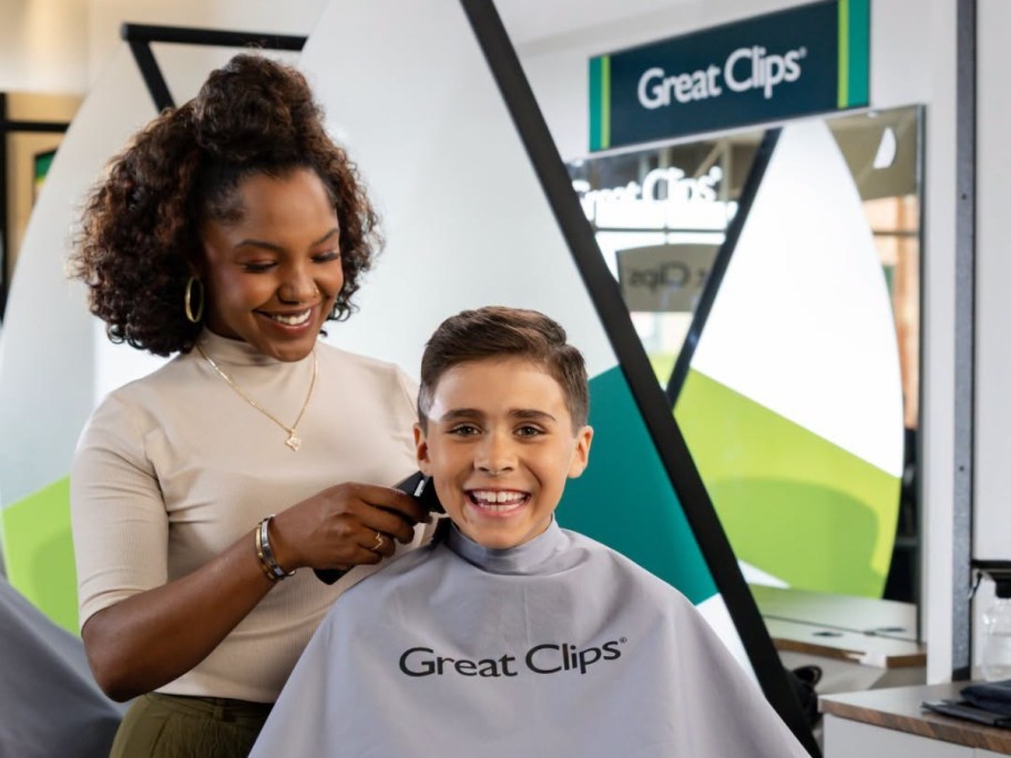 woman cutting the hair of a boy at Great Clips