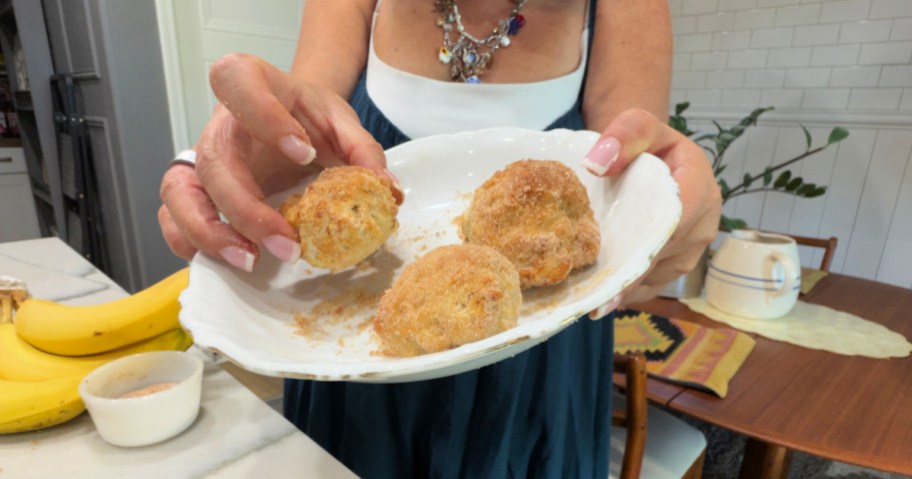 holding a donut hole