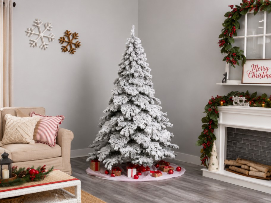 flocked christmas tree in a living room