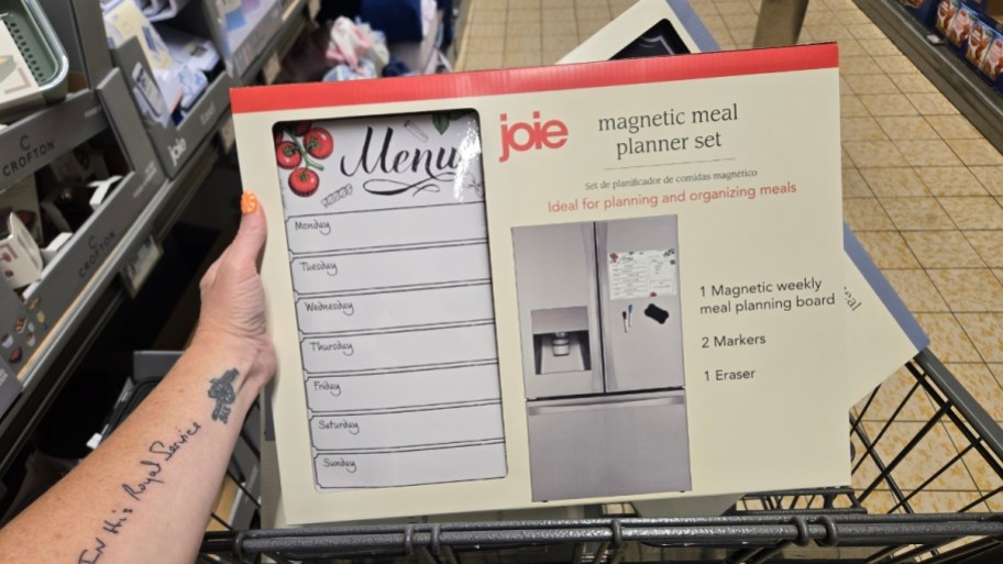 a hand holding meal planner kit