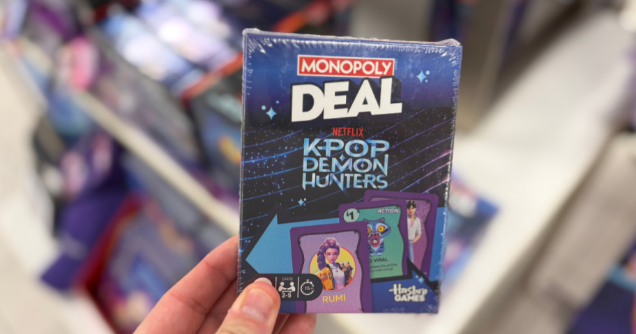 hand holding monopoly card game