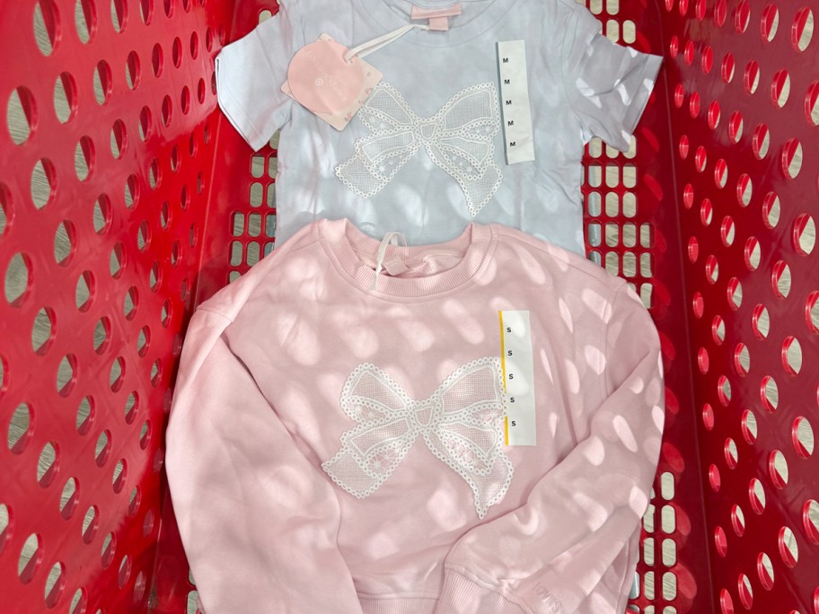 pink sweatshirt and blue tee in target shopping cart 