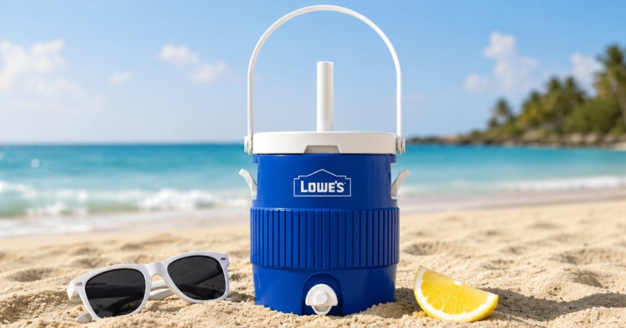 a blue and white Lowe's cooler cup on a beach