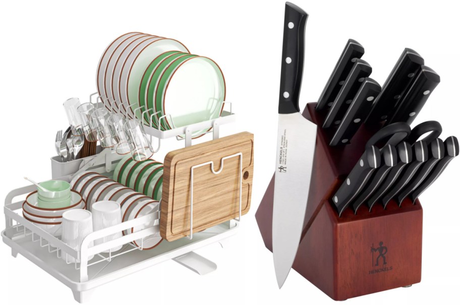 A white two-tier dish drying rack holding dishes and a cutting board on the left, alongside a wooden Henckels knife block set with black-handled knives on the right.