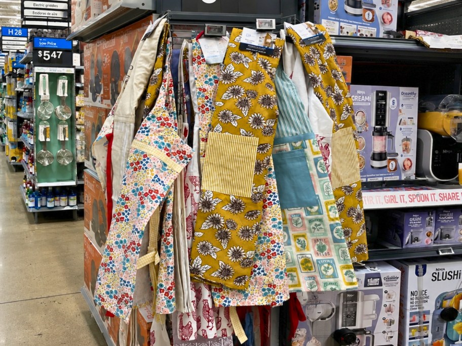 vintage style aprons on a end cap in a Walmart store