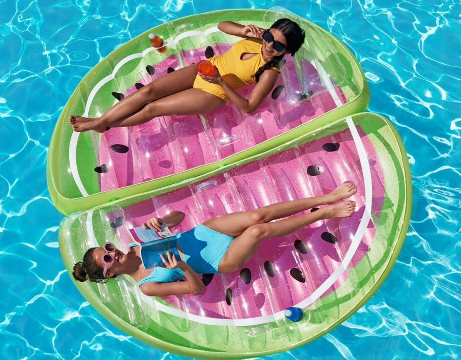 two people on a 2 person watermelon slice pool float