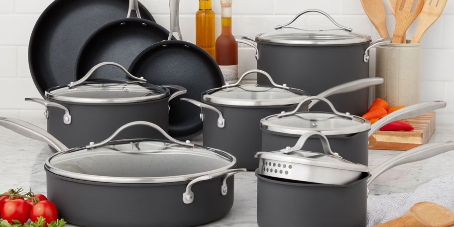 gray cookware set on counter with lids 