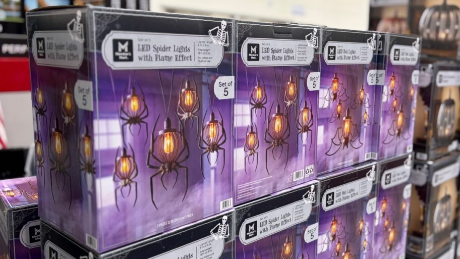 boxes of halloween flame lights on a shelf in a store