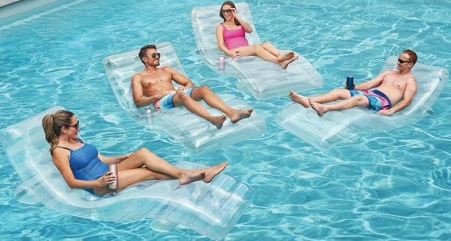 people floating in pool 