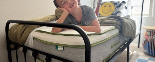 kid laying on novilla mattress