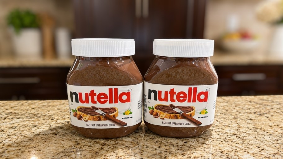 two 22oz jars of nutella on a kitchen countertop