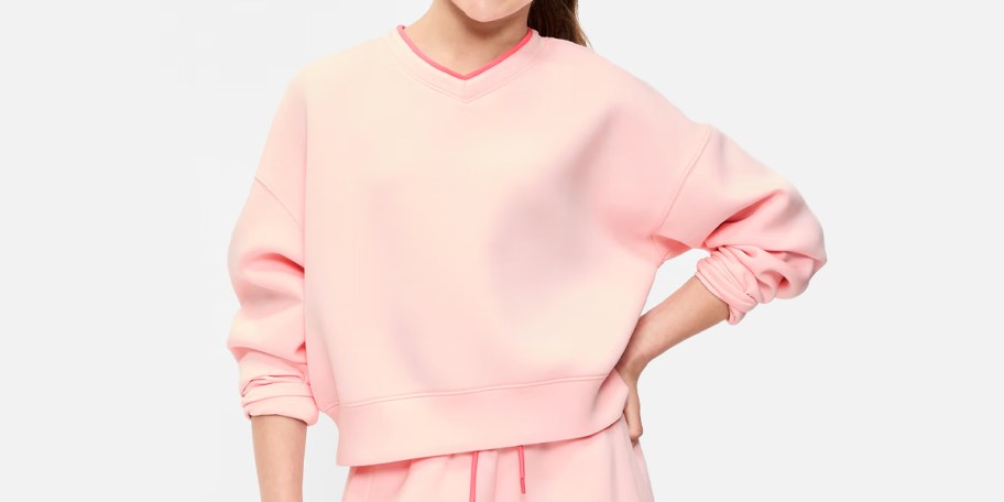 girl wearing pink sweatshirt