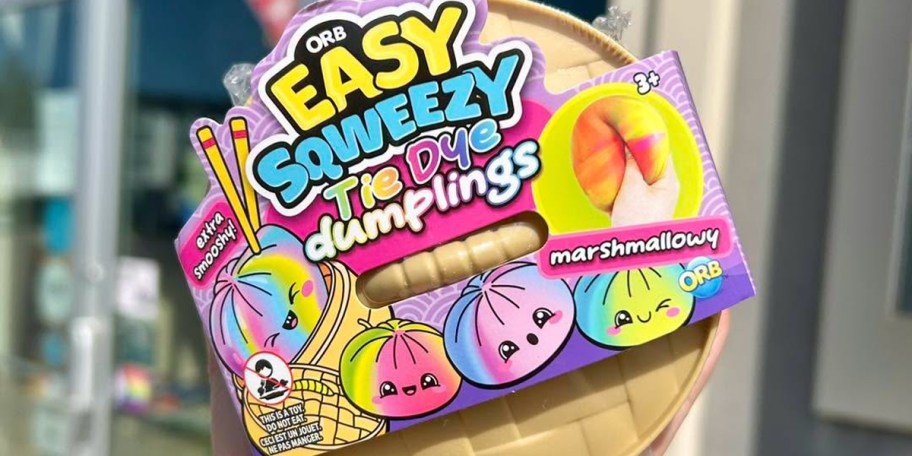 hand holding orb dumpling toy 
