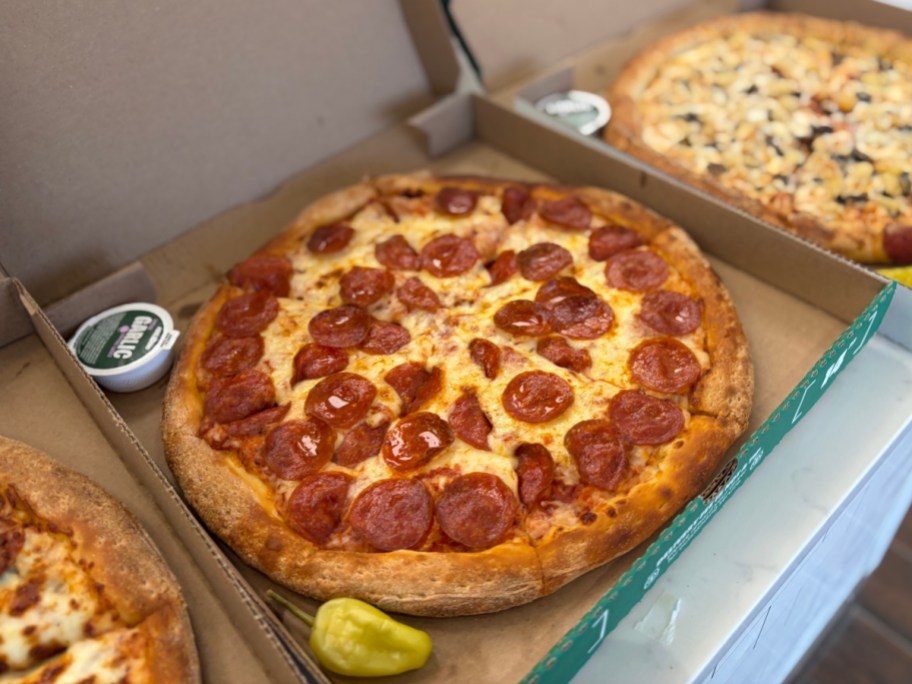 3 open boxes of Papa Johns pizza
